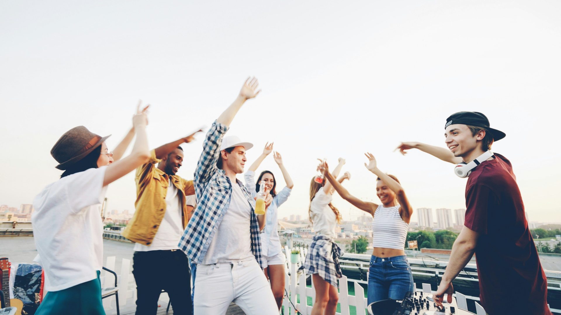 Group of young people dancing on a rooftop